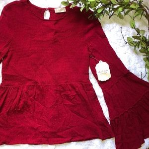 Flared burgundy top
